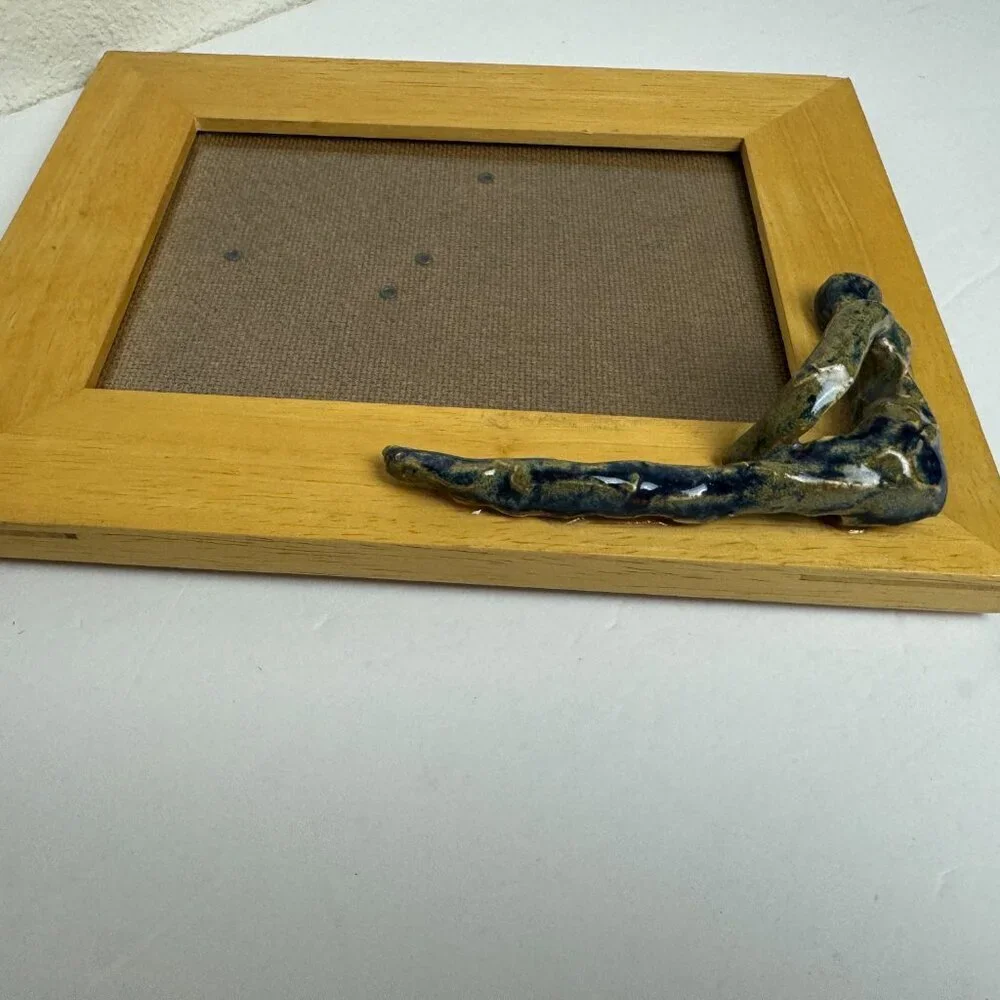 Exclusive! Wooden frame with a ceramic sculpture of a man Handmade